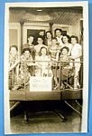 This real picture postcard is from the Riverview Park in Chicago. It is in very good condition but there is slight wear and slight curling. The front features a group of women on a train with a sign t...