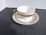 Japan Demitasse White Porcelain with Gold Trim cup and saucer. No chips or cracks. Gold trim over all excellent condition on cup very slight fading on saucer. Height of cup and saucer 2 inch. Height o...