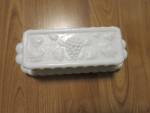 Vintage Westmoreland Milk Glass Butter Dish Paneled Grape Pattern. This lidded butter dish is in great vintage condition with no chips or cracks. There is an indent on the inner of lid rim, that from ...