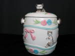 Japan Cracker Biscuit Cookie Jar petite no handle. What a cute jar. This jar is marked with a black stamp mark Japan. 1940s to 1950s. A must have harder to find version<BR> Height 7 inch diameter over...