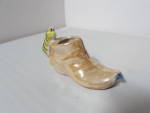 Lusterware Cat on Shoe Made in Japan. No chips, cracks or crazing. Does have a few spots of black paint on side of shoe as seen in picture from the making. Lovely item. Marked in Black Made in Japan a...