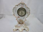 Antique Porcelain Thermometer Mantle Clock  R C Germany. Lovely White Porcelain with floral decal and hand painted trimmed in Gold. <BR><BR>Clock appears to be overwound and the switch lever is missin...