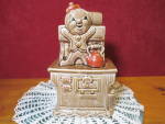 Vintage The Gingerbread Man on Stove Cookie Jar Japan. Awesome Cookie Jar with The Gingerbread Man standing on the Wood Cook Stove next to the Tea Kettle. The side has an ash or coal bucket. The front...