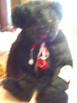 Vermont Teddy Bear. A very large 24 inch tall black bear with his hang tags marked 1992 in like new conditiion. He is a longer haired bear in faux fur with black eyes and a red suede nose with red and...