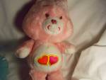 Care Bear Love A Lot from 1983 by Kenner for American Greetings. She is a 13 inch tall bear with pink, fluffy fur with 2 hearts on her tummy. She is in great condition with and is a nice, earlier Care...