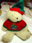 Vermont Teddy Bear with his tag marked 1993, made in Vermont. He is a sweet jointed fuzzy light brown bear dressed in his original green and red elf hat and his red with green knit sweater with a Chri...