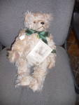 Hermann Millennium bear with tags marked made in Germany. He is a wonderful, jointed, 18 inch tall bear with his shaggy beige fur and darker brown paw pads. He is marked that he has a built in time ca...
