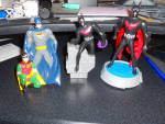 Batman toys set of three different toys. There is a round wheel based batman marked burger king that is 5 3/4 inch tall and 3 1/4 inch wide, a Batman and Robin figure with a loop for hanging that is 4...