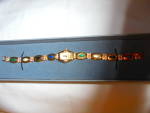 Alto Quartz Watch Jewel band with the box marked Alto, Quartz, made in Japan. It has the pretty face with clear jewels around and the 8 stoned sections of the band with clear jewel separators. It is 8...