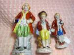 Victorian Style Figurine set of 3 different figures. The largest, 6 inches high has the lovely colors and detail with the man standing on a base and is marked hand painted Japan. The second figure is ...
