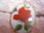 Milk Glass Rose Painted Pin Lovely Gold Tone.Pretty, Oval Red Rose Pin with a nice gold toned backing. It is not marked and is 1 5/8 inches high and 1 1/4 inches wide. In very good used condition. Cla...