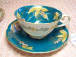 CDGC Cup and Saucer Made in Japan. Lovely color with wonderful gold accented patterns of flowers and leaves. It is marked CDGC China with a symbol and made in Japan. It is in excellent condition and i...