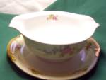 NSP China Japan Gravy bowl Dish with attached underplate in wonderful condition. It is marked NSP china made in Japan with a nice crown mark. It is in such a pretty shape with beautiful flower pattern...
