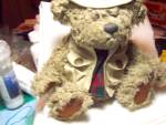 Tanner Brass Button Fisherman Teddy Bear he is a Brass Button bear by Pickford Bears LTD. He is a cute, fuzzy, grey, jointed bear dressed in his tagged fisherman's hat and his fishing vest with the ta...