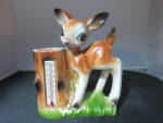 Vintage Bambi Vase with Thermometer Made in Japan paper label. Cute as can be. Best guess circa 1950s to 1960s. Thermometer still works.<BR><BR>Height 5 1/2 inch X Length 4 1/2 inch X Width from to ba...