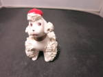 Vintage spaghetti Poodle Figurine Sitting with a Red Hat Japan. Adorable Poodle Figurine. <BR><BR>Has some crazing of the glaze on the solid. The applied Spaghetti, one of the front legs and one of th...