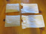 Antique Doll Pillows Ticking Fabric with pillow cases that have milk glass button closure, two buttons on each case. <BR><BR>This lot of two antique pillows are made with the blue and white antique ti...