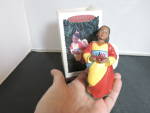 Hallmark Keepsake Celebration of Angels African number 2 in series. She is lovely with her yellow dress and red with blue sash and cape. <BR><BR>Height 4 1/2 inches.<BR><BR>She is in excellent conditi...