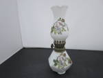 Miniature Milk Glass Oil Lamp hand painted Rose Motif. Lovely shape bottom is six sided with the Rose painting on each side. The Shade is Milk Glass and only has the Rose painting on one side. Height ...