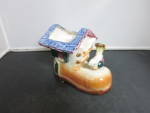 Vintage Shoe House Planter with Bird. Adorable, shoe planter with a sweet bird on the toe marked made in Japan on bottom. <BR><BR>It has a dark brown edge heel and sole, and shaded a lighter brown, li...
