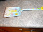 Tin toy sand shovel with a cute sea shore Mermaid design. It is 1 inch high, 12 inches long and 3 3/4 inches wide. Very cute and in played with condition with paint lost and some rust as seen. Sold ju...