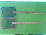 Pair of Advertisement Fly Swatters for the Pure Milk Co. Portsmouth, O. and Ashland, Ky. I would call them his/hers due to the outside color border of the mesh.  18 1/2" length and the mesh porti...