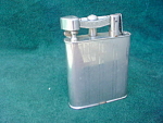 Very Large, somewhat of a novelty Cigarette Lighter.  Underside is marked Reliance Made in Occupied Japan.  Measures about 3 3/4" in height and 2 3/4" in width.  Appears to be in very good c...