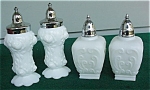 Offered is (2) different pair of Milk Glass S&P Shakers.  The smaller set is marked the IG on the bottom indicating it was made by the Imperial Glass Co., Bellaire, Oh and the other pair I'm uncertain...