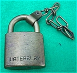 Early Brass Padlock marked on one side Waterbury and on the other U.S. Set.  Very good overall condition.  Attached to the Lock is a small brass chain.  Sorry I do not have a key.  Great addition to a...