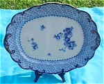Flow Blue Style Platter measuring about 15" in length by 12 1/4" in width.  As shown in the last couple photos the Platter has markings on the underside.  In blue, one mark says Theodore 1 E...
