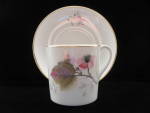 This delicate english bone china demi tasse size cup and saucer has a pretty pattern of a pink flower with a black center on a white background trimmed in gold. Made by Shelley in the mocha shape, the...