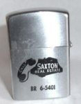Continental Advertising lighter for a Real Estate Company. Nice spark. Has little finish wear on back. Finish fade on front. $5.00 Shipped in the USA