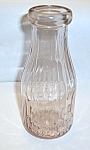 VINTAGE PINK LIBERTY MILK CO. BUFFALO N.Y. MILK BOTTLE. MEASURES 7 1/4H X 31/4W INCHES. NO CHIPS OR CRACKS. NEEDS A GOOD CLEANING. CUSTOMER PAYS INSURED AND 2 POUND SHIPPING CHARGES. CONTACT ME FOR SH...
