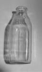 I TOOK SOME DIFFERENT ANGLES TO SHOW THE BOTTLE. HERE`S AN OLD EMBOSSED CASTLE`S MILK BOTTLE QUART SIZE.  ON THE BOTTOM EMBOSSED IS E 68 11  ON THE 4 DIFFERENT SIDES ARE EMBOSSED - ONE QUART - LIQ - X...