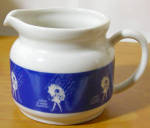 VINTAGE MORTON SALT CREAMER THAT HAS STAMPED MADE IN JAPAN ON THE BOTTOM . THE CREAMER HAS THE SLOGAN OF "WHEN IT RAINS IT POURS".<BR><BR>CREAMER IS IN VERY GOOD CONDITION. THERE ARE NO CHIP...