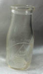VINTAGE EMBOSSED HALF PINT  H & H DAIRY IN A TRIANGLE SHAPE EMBLEM. MASSENA N.Y.<BR>ON THE BACK SAYS: SEALED K9 IN A CIRCLE. NO CHIPS OR CRACKS.<BR>VERY BOTTOM HAS A SPIRAL MADE INTO THE GLASS. SEE PI...