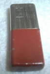JAPAN SLIM  RED / CHROME. NICE SPARK. HAS A THUMB DENT  ON THE RED. NICKS TO THE FINISH. MEASURES 1 3/4L X 3/4W INCHES.