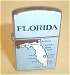 FLORIDA JAPAN LIGHTER. NICE SPARK. NEVER USED. COUPLE NICKS ON ENAMEL. ADD $5.00 FOR SHIPPING IN THE U.S.A.