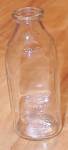 This is a vintage clear glass quart size milk bottle marked in raised letters on the top shoulder, CSC.  On the underside base in raised letters it states "Comalac, L.A., Reg. Cal." then som...