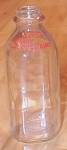 This is a vintage clear glass quart size milk bottle marked on two sides of the top shoulder in red letters, "Sunny Slope Dairy".  There is no indication of where this dairy is/was located. ...