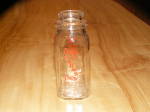 Fun find out of a home.  This is a vintage glass dairy bottle or milk bottle or cream bottle in the small half pint (1/2 pint) size.  Used by and marked for Orange Farms Dairy of Dallas, PA, which is ...