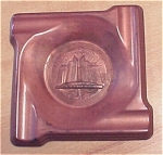 Small molded copper ashtray, indented in center with round relief of Chrysler Motors building, labelled above 'A Century of Progress, Chicago 1933' and below, 'Plymouth Dodge De Soto Chrysler'.  Basic...