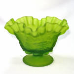 This 1970s ruffled rim candy dish number PG-114 in Green Mist by Westmoreland Specialty Glass is in the Paneled Grape pattern, which is almost always associated with milk glass. Colors were much less ...