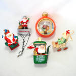 Five Hallmark Keepsake Christmas ornaments, all displayed on an Idaho family's Christmas tree going back more than 30 years:<BR><BR>1984 Baby's First Christmas, a baby wearing a flocked green snowsuit...