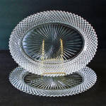 Two clear depression glass oval platters in the Miss America pattern by Hocking Glass, produced from 1935 to 1938 (the name was changed to Anchor Hocking in 1937). They're 12-1/4 by 9-1/4 inches. One ...
