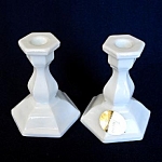 A pair of small milk glass candlesticks by Tiara, just 3 inches tall by 2-1/2" diameter at the hexagonal bases. They are in perfect, mint condition - in fact one still has its gold foil Tiara Exc...