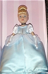 Madame Alexander 9 inch vinyl 2003 Cinderella in blue ball gown from Disney version of this fairy tale. She has rooted blonde hair styled in a bun with blue ribbon, and blue painted eyes. She is weari...