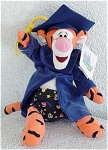 Disneyland Gradnite Tigger the Tiger from Winnie the Pooh and friends mini-bean bag is approximately 8 inches tall, and he is wearing printed Bermuda Shorts under his dark graduation robe, a dark blue...