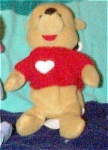 Disney Valentine's Day Winnie the Pooh bear is dressed in a knitted red sweater with a white heart mini-bean bag plush, has a Mousketoys Tag from Disneyland.  Winnie the Pooh is approximately 8 inches...