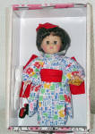 Vogue 2002 International Ginny doll from Japan. This 8 inch Ginny has black hair with a red hair bow and moving brown eyes. Her Japanese national costume includes a vibrant red, blue, yellow, and gree...